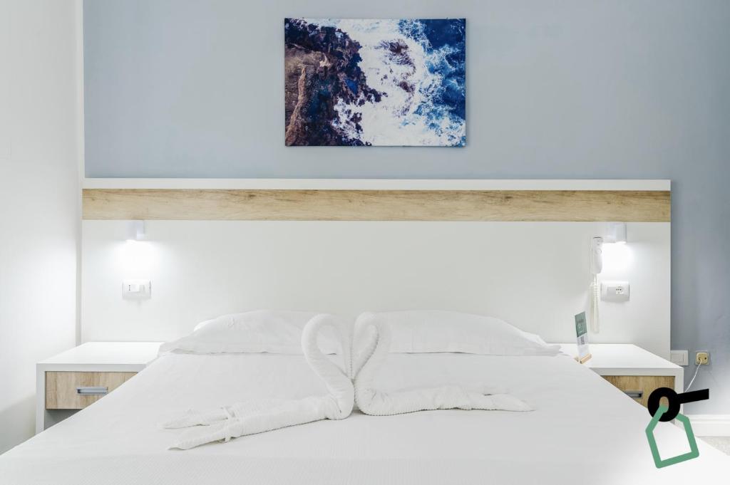 Postel nebo postele na pokoji v ubytování Hotiday Room Collection - Rapallo