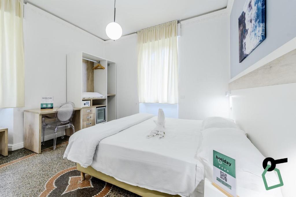 Postel nebo postele na pokoji v ubytování Hotiday Room Collection - Rapallo
