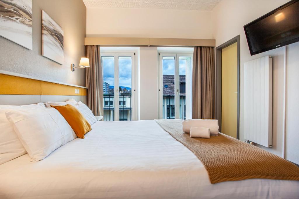 Postel nebo postele na pokoji v ubytování Hotel La Longeraie