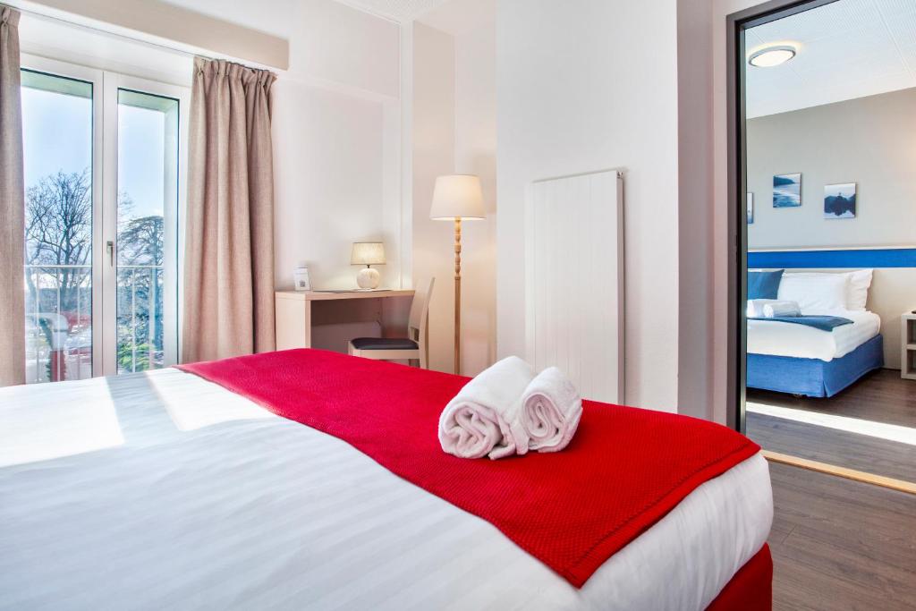 Postel nebo postele na pokoji v ubytování Hotel La Longeraie