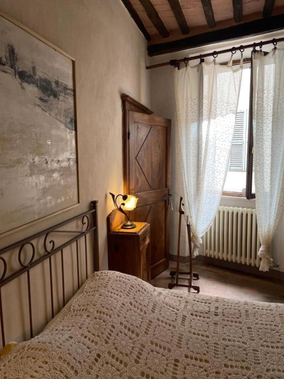 Postel nebo postele na pokoji v ubytování Guesthouse da Idolina dal 1946