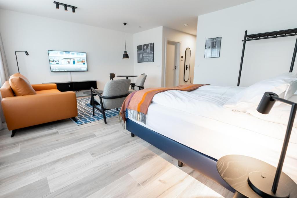 Postel nebo postele na pokoji v ubytování Hlemmur Suites