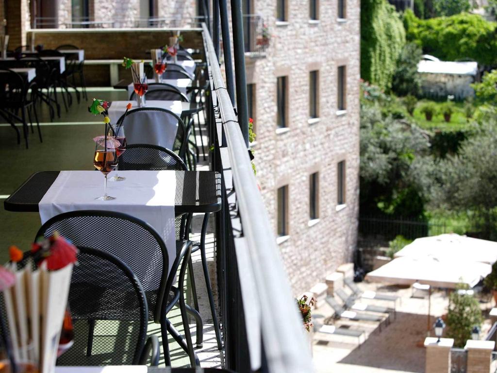 A balcony or terrace at Giotto Hotel & Spa