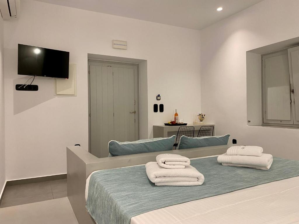 Postel nebo postele na pokoji v ubytování Asteras Mini Suites