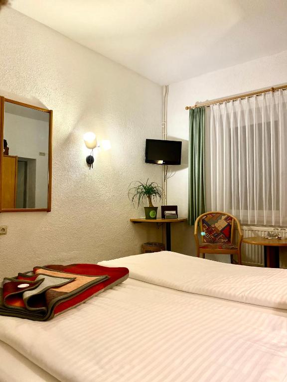 TV a/nebo společenská místnost v ubytování Pension Am Strand