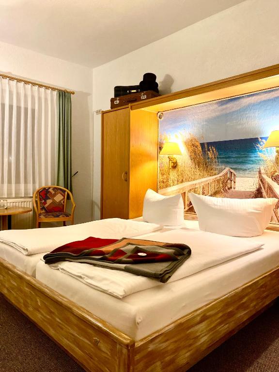 Postel nebo postele na pokoji v ubytování Pension Am Strand