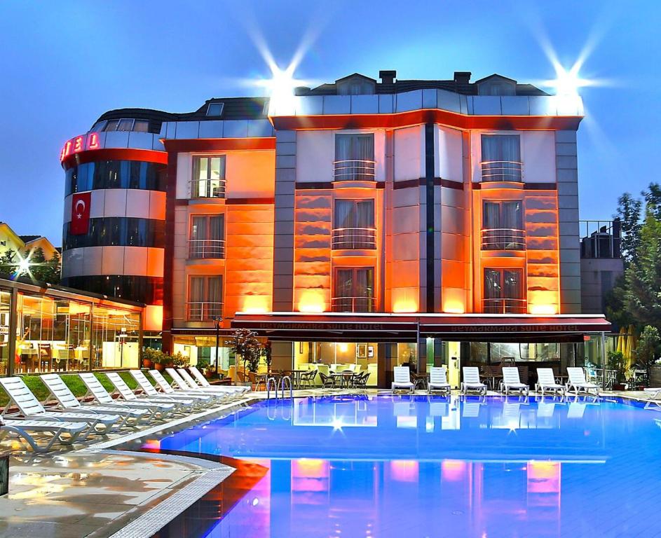 a hotel with a swimming pool in front of a building at Gardan Hotel in Beylikduzu