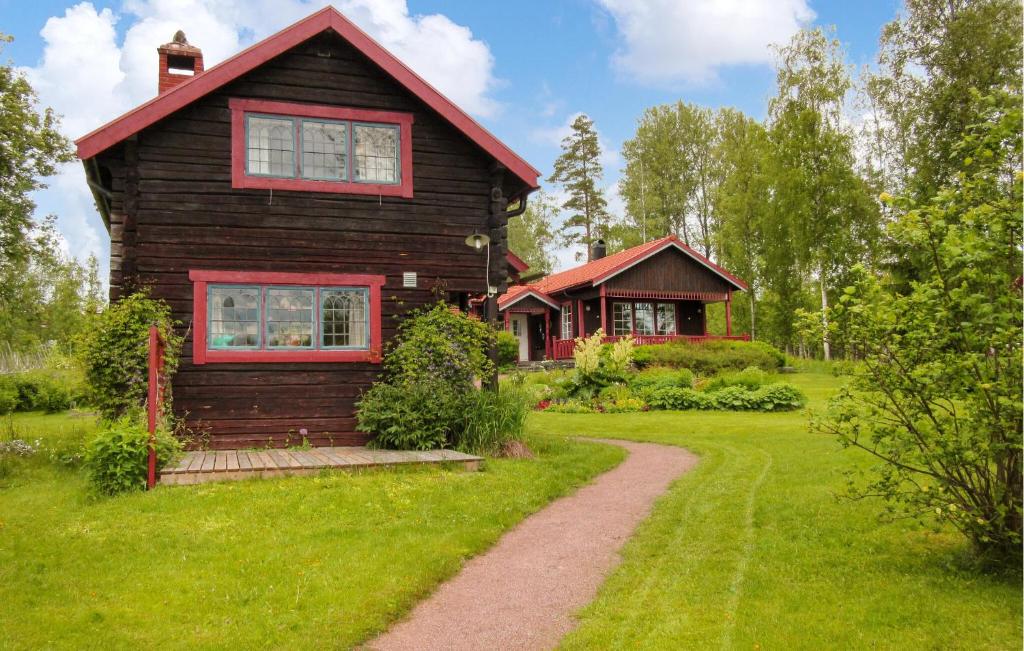 a small house with a path leading to it at Beautiful Home In Leksand With Wifi in Leksand
