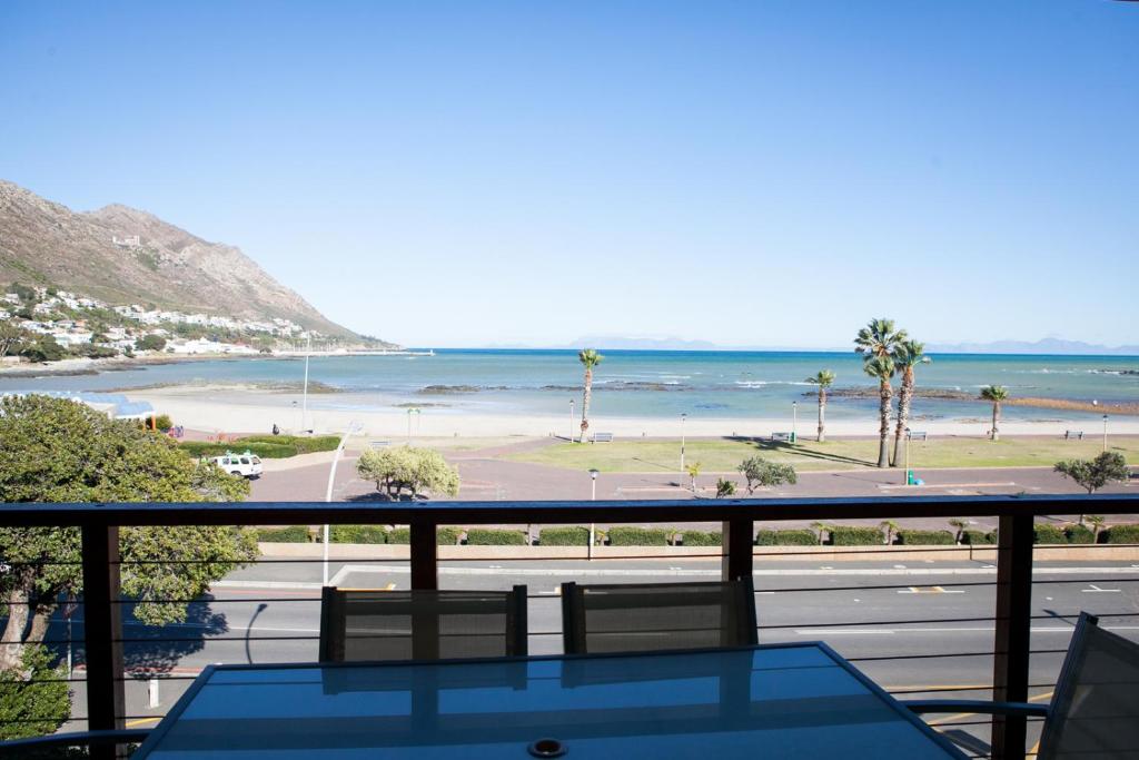 a view of the beach from the balcony of a condo at Summer Place Gordons Bay in Gordonʼs Bay