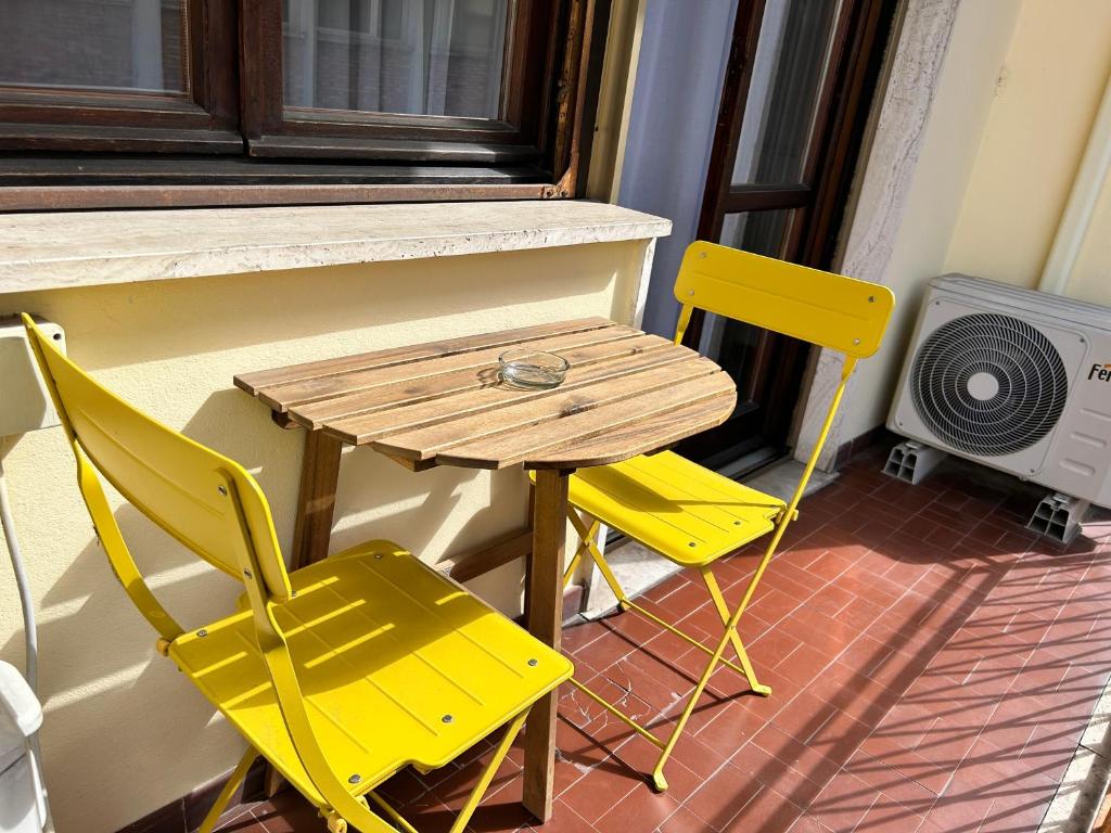 Uma área de estar em Hotel Cecile