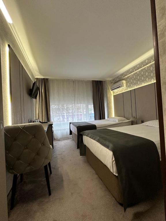 Postel nebo postele na pokoji v ubytování Hotel Cosmos
