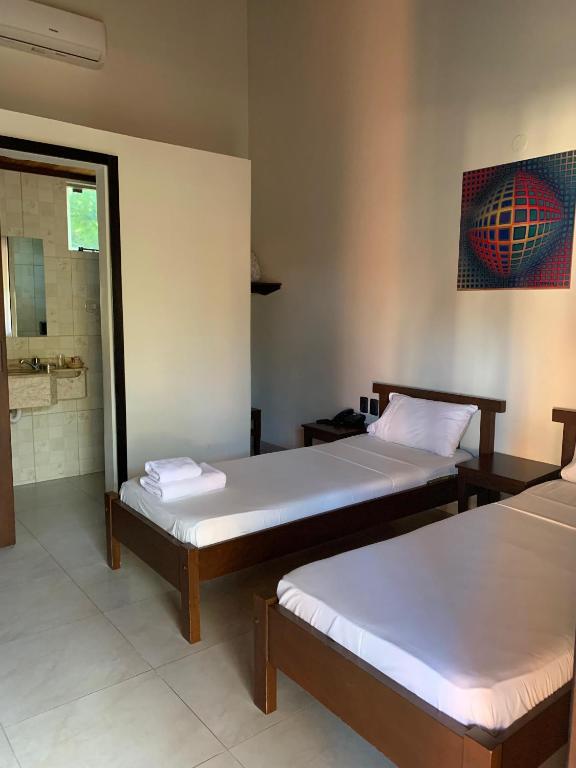 Postel nebo postele na pokoji v ubytování Hotel Il Castello