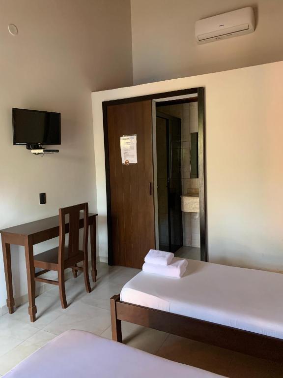 Postel nebo postele na pokoji v ubytování Hotel Il Castello