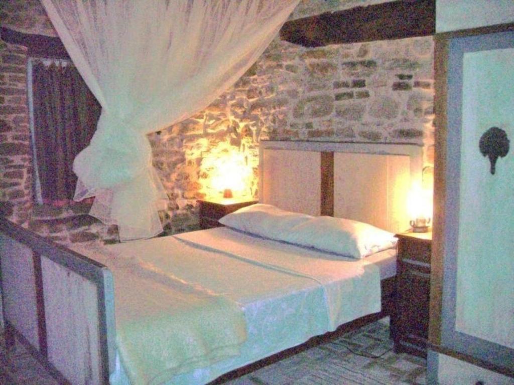 Кровать или кровати в номере Ferienwohnung für 2 Personen 1 Kind ca 25 qm in Piandimeleto, Marken Provinz Pesaro-Urbino