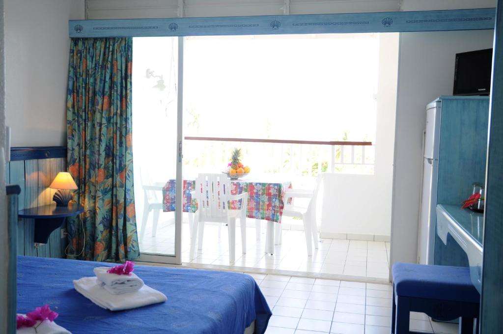 Postel nebo postele na pokoji v ubytování Résidence Tropicale
