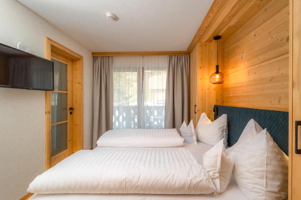 Postel nebo postele na pokoji v ubytování Garni Residence Alnö - Adults Only