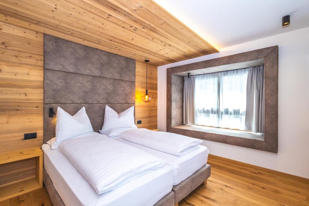 Postel nebo postele na pokoji v ubytování Garni Residence Alnö - Adults Only