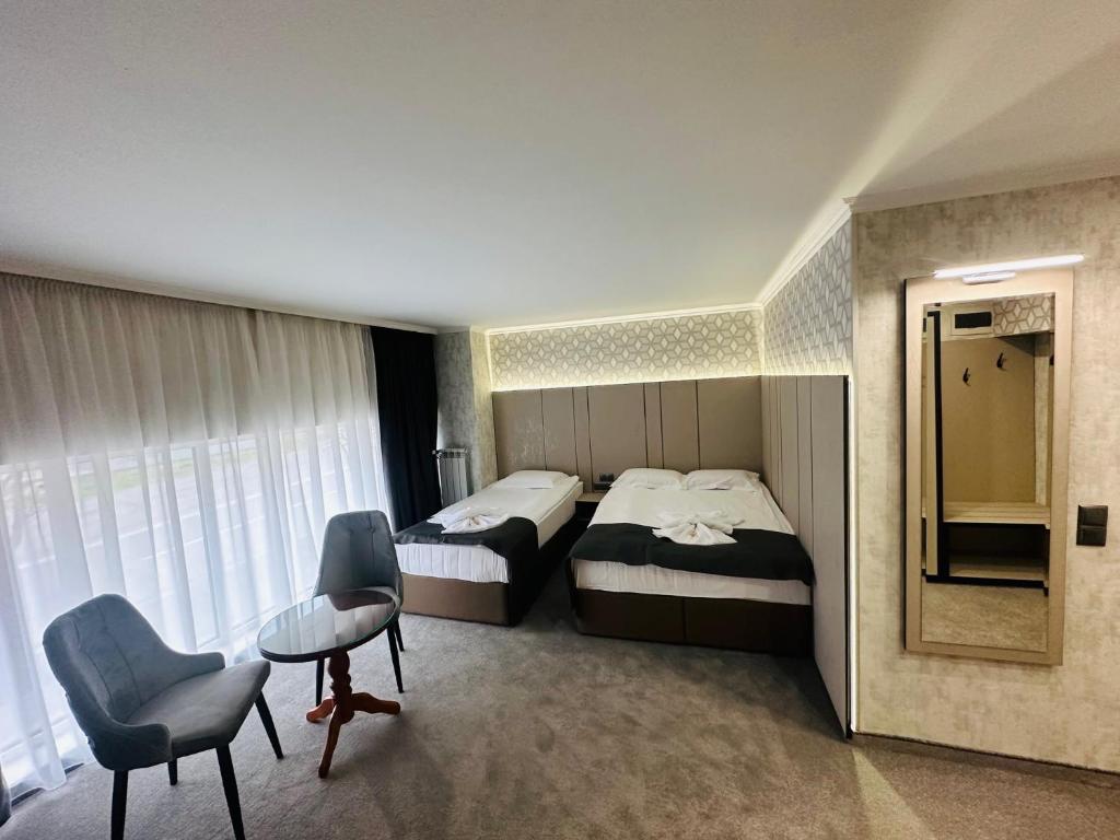 Postel nebo postele na pokoji v ubytování Hotel Cosmos