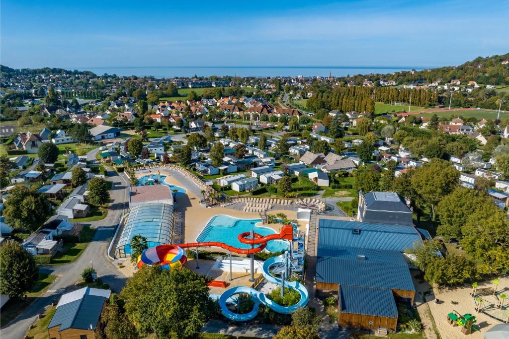 an aerial view of a water park with a water slide at Camping La Vallée - Roan in Houlgate