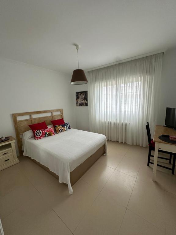 Łóżko lub łóżka w pokoju w obiekcie Vivienda Cousillas
