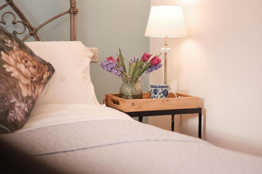 Ένα ή περισσότερα κρεβάτια σε δωμάτιο στο Lilac Cottage Morpeth Northumberland