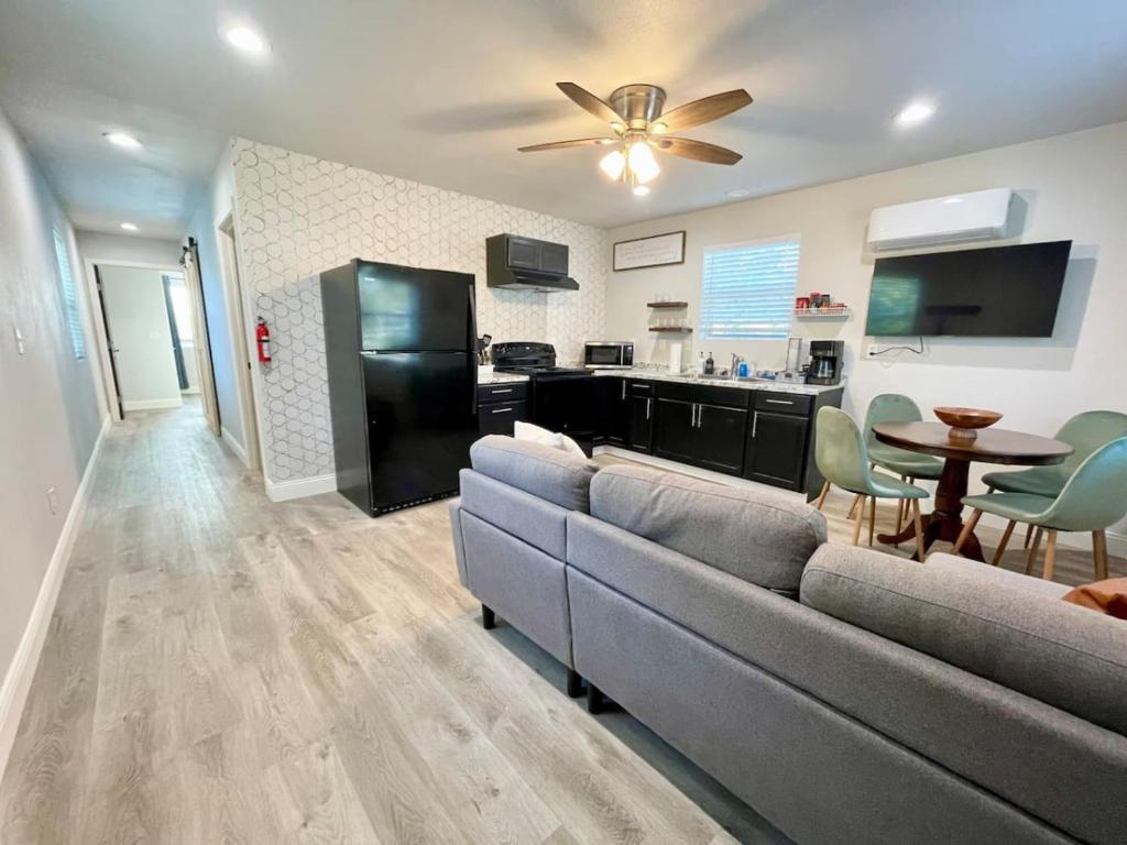 a living room with a couch and a table at Tritch Cottage at Wrenwood Ranch in Johnson City