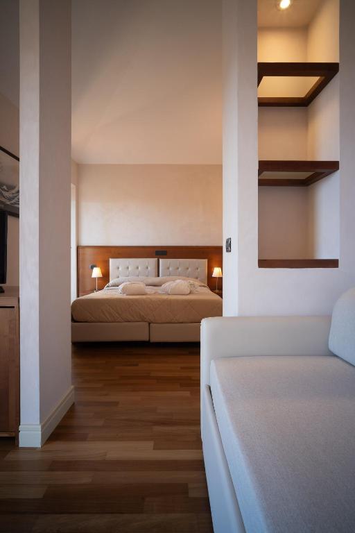 Postel nebo postele na pokoji v ubytování Hotel Rosa