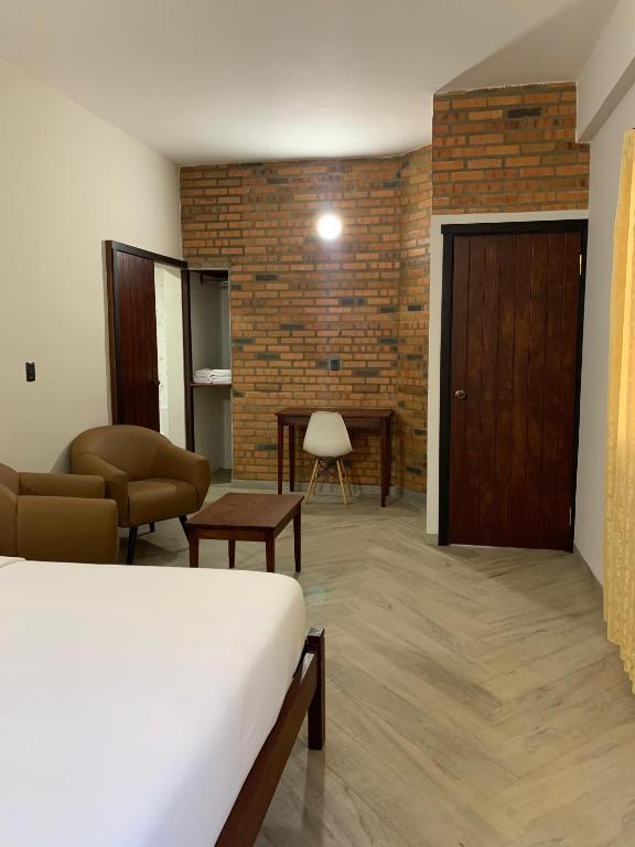 Postel nebo postele na pokoji v ubytování Hotel Il Castello