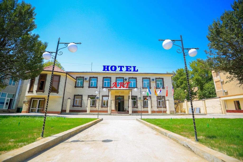 un edificio de hotel con un cartel encima en ART SAMARQAND HOTEL B&B near railway station, en Samarkand