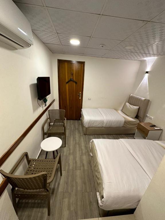 Postel nebo postele na pokoji v ubytování Egy Days Hotel