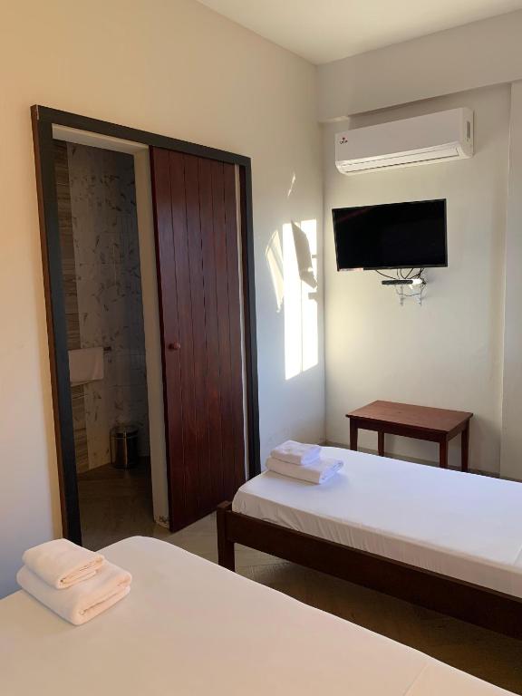 Postel nebo postele na pokoji v ubytování Hotel Il Castello