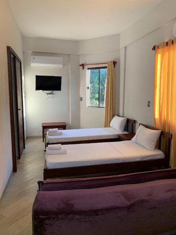 Postel nebo postele na pokoji v ubytování Hotel Il Castello