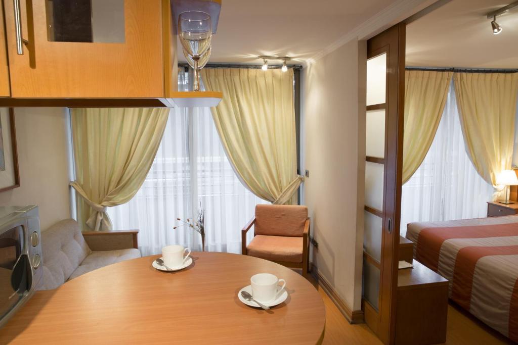 Postel nebo postele na pokoji v ubytování Andes Suites