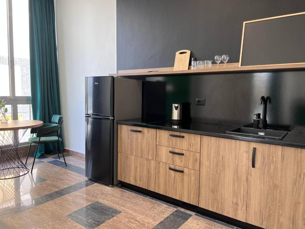 Kuchyň nebo kuchyňský kout v ubytování Cactus Apartments