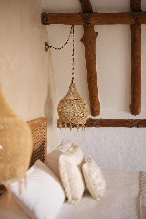 Postel nebo postele na pokoji v ubytování Casa Las Tortugas Petit Beach Hotel & Spa