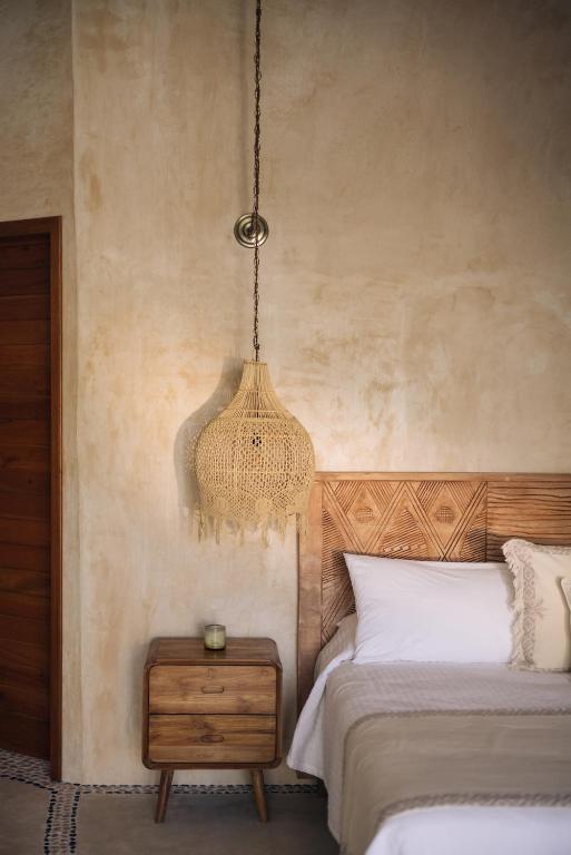 Postel nebo postele na pokoji v ubytování Casa Las Tortugas Petit Beach Hotel & Spa