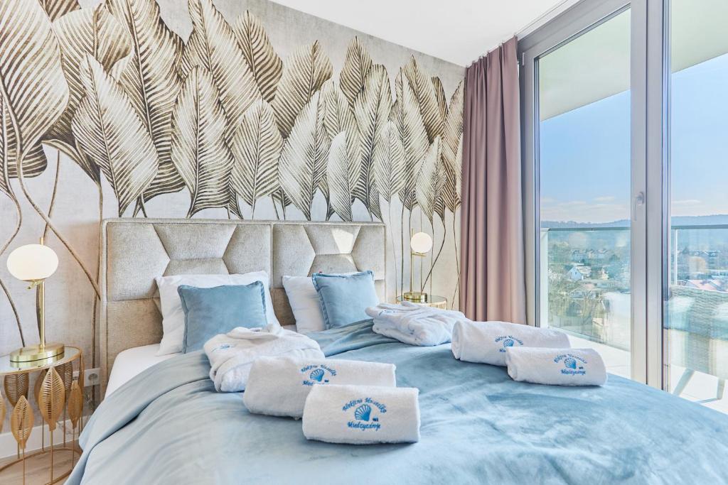 Postel nebo postele na pokoji v ubytování Wave Resort&SPA - Blue Shell Apartment