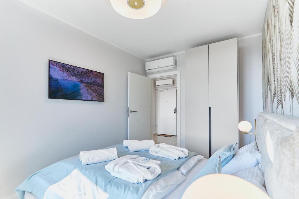 Postel nebo postele na pokoji v ubytování Wave Resort&SPA - Blue Shell Apartment