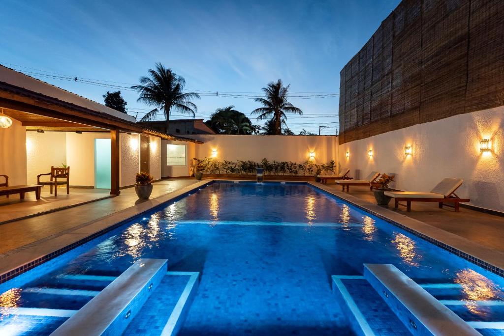 a swimming pool in the middle of a house at Villa Alexandre Pousada - Trancoso in Trancoso