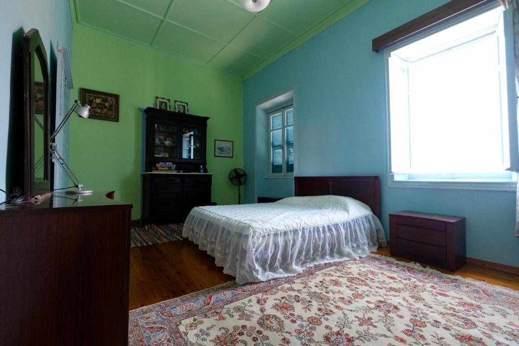 A bed or beds in a room at Archontiko Pataka