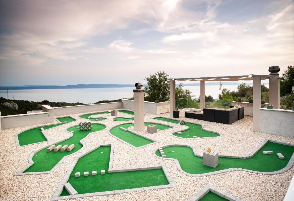 a miniature golf course on top of a house at Villa Rita in Makarska