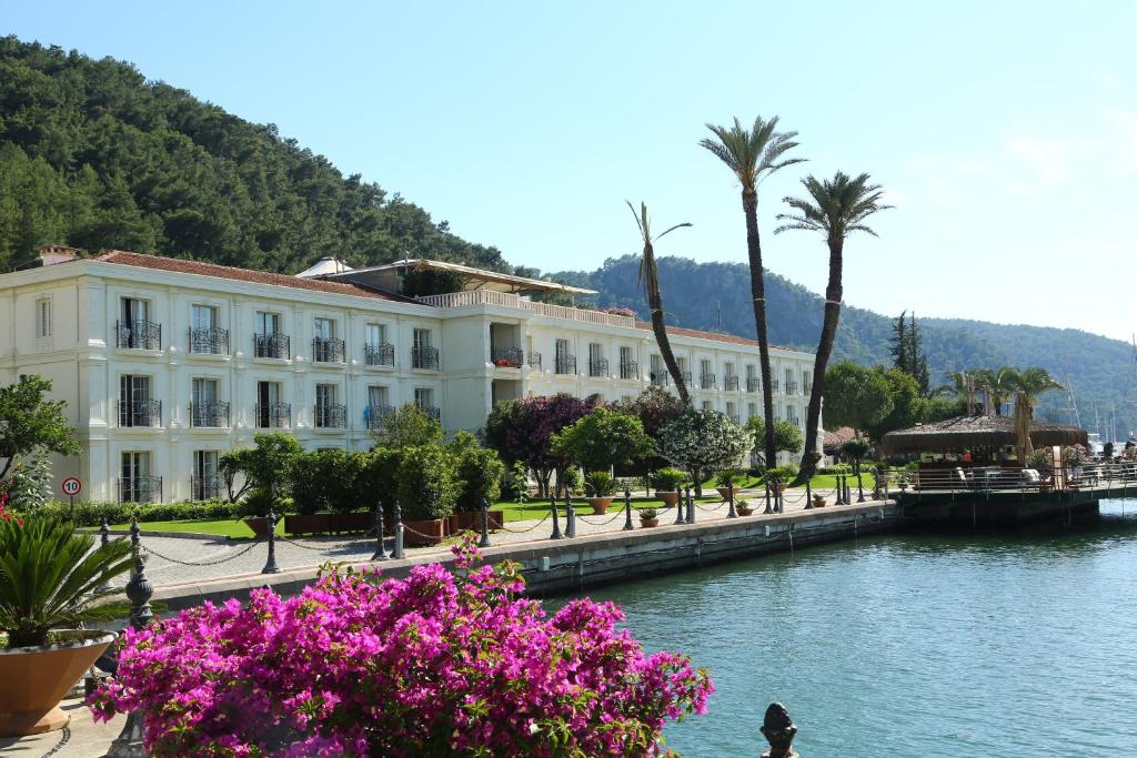 
a large body of water with palm trees at Ece Saray Marina Resort in Fethiye
