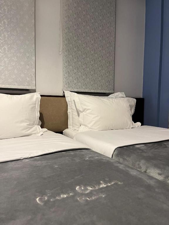 Postel nebo postele na pokoji v ubytování Dream's Hotel