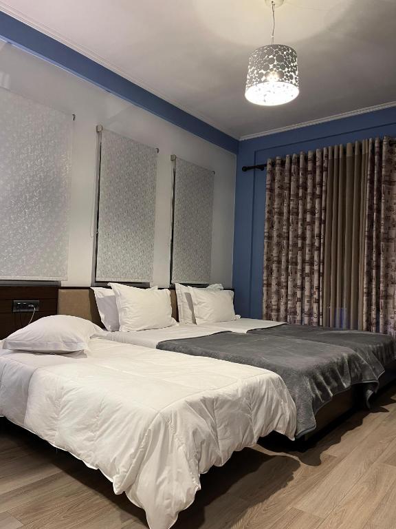 Postel nebo postele na pokoji v ubytování Dream's Hotel