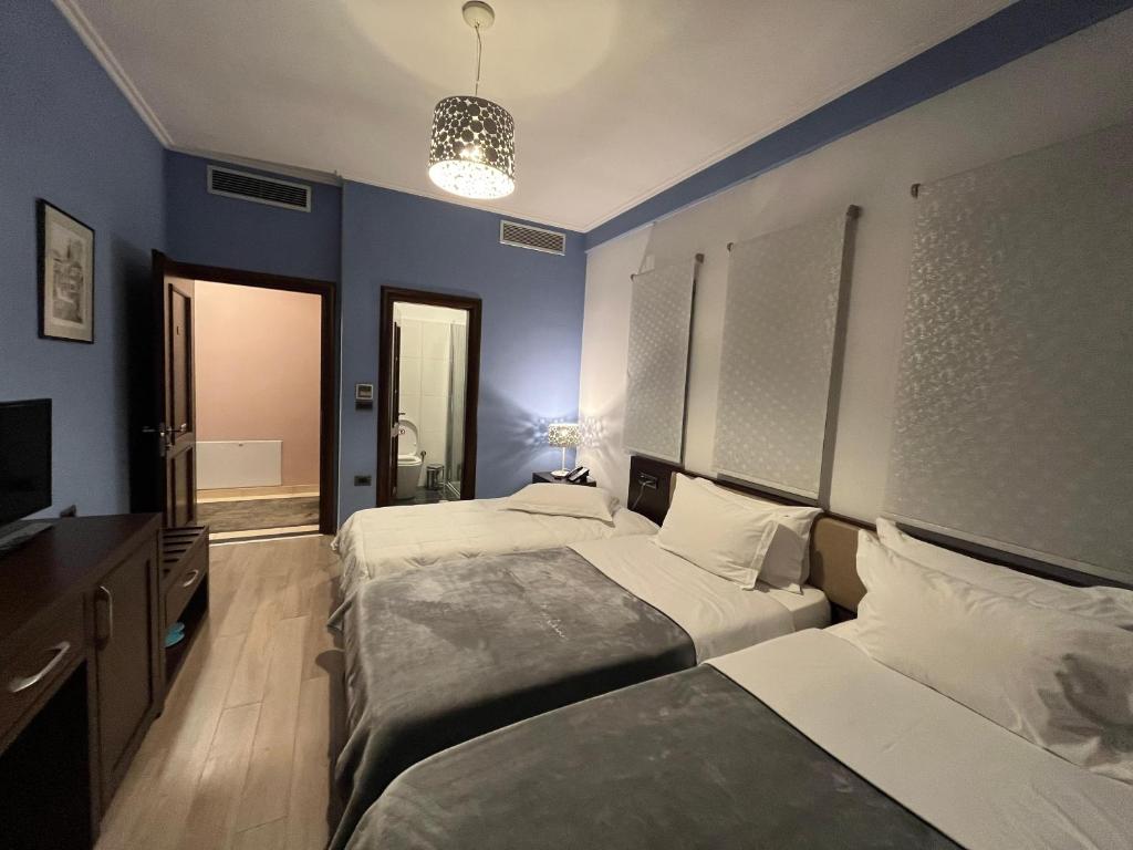 Postel nebo postele na pokoji v ubytování Dream's Hotel