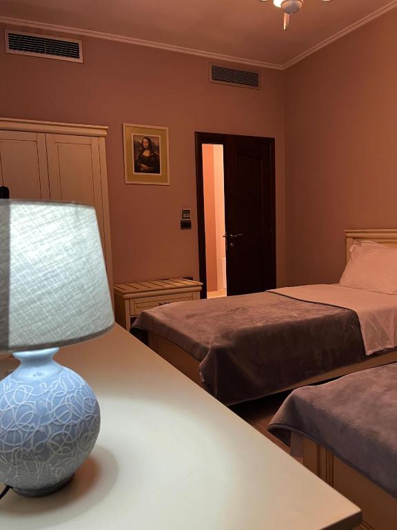 Postel nebo postele na pokoji v ubytování Dream's Hotel