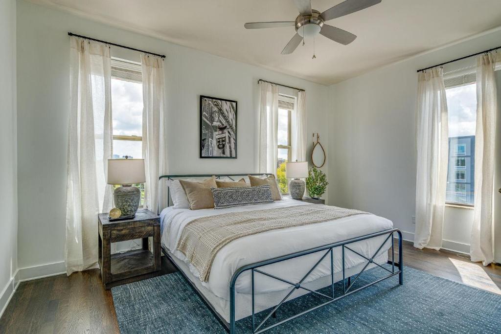 a bedroom with a bed with a ceiling fan at LOFTS AT 30TH - MODERN LOFT - MINS TO BROADWAY in Nashville