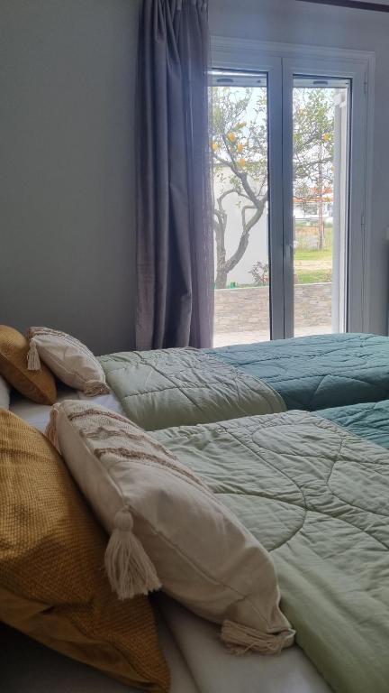 Ένα ή περισσότερα κρεβάτια σε δωμάτιο στο Voulitsa's Apartment