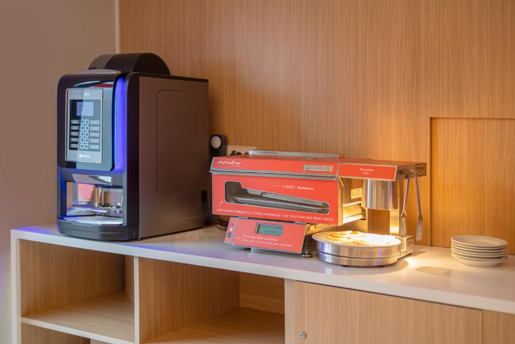 Kuchyň nebo kuchyňský kout v ubytování Moov Hotel Porto Norte