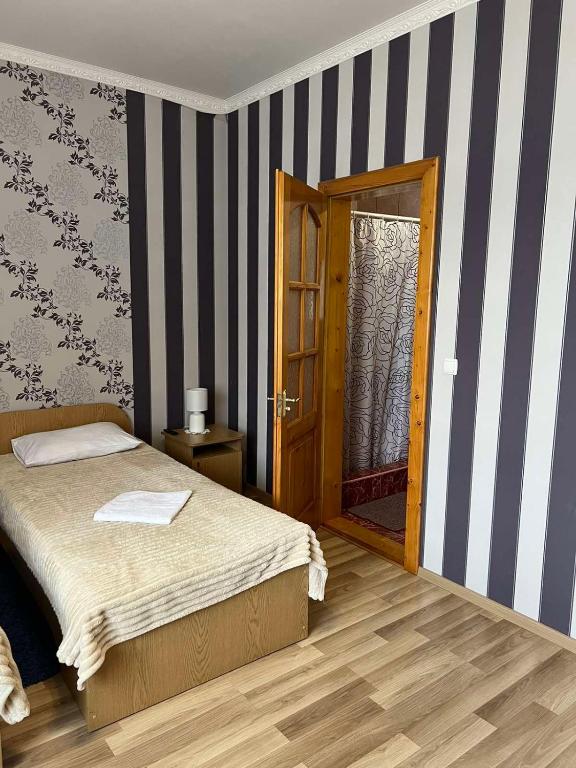 Postel nebo postele na pokoji v ubytování Mini-Hotel "Nord"